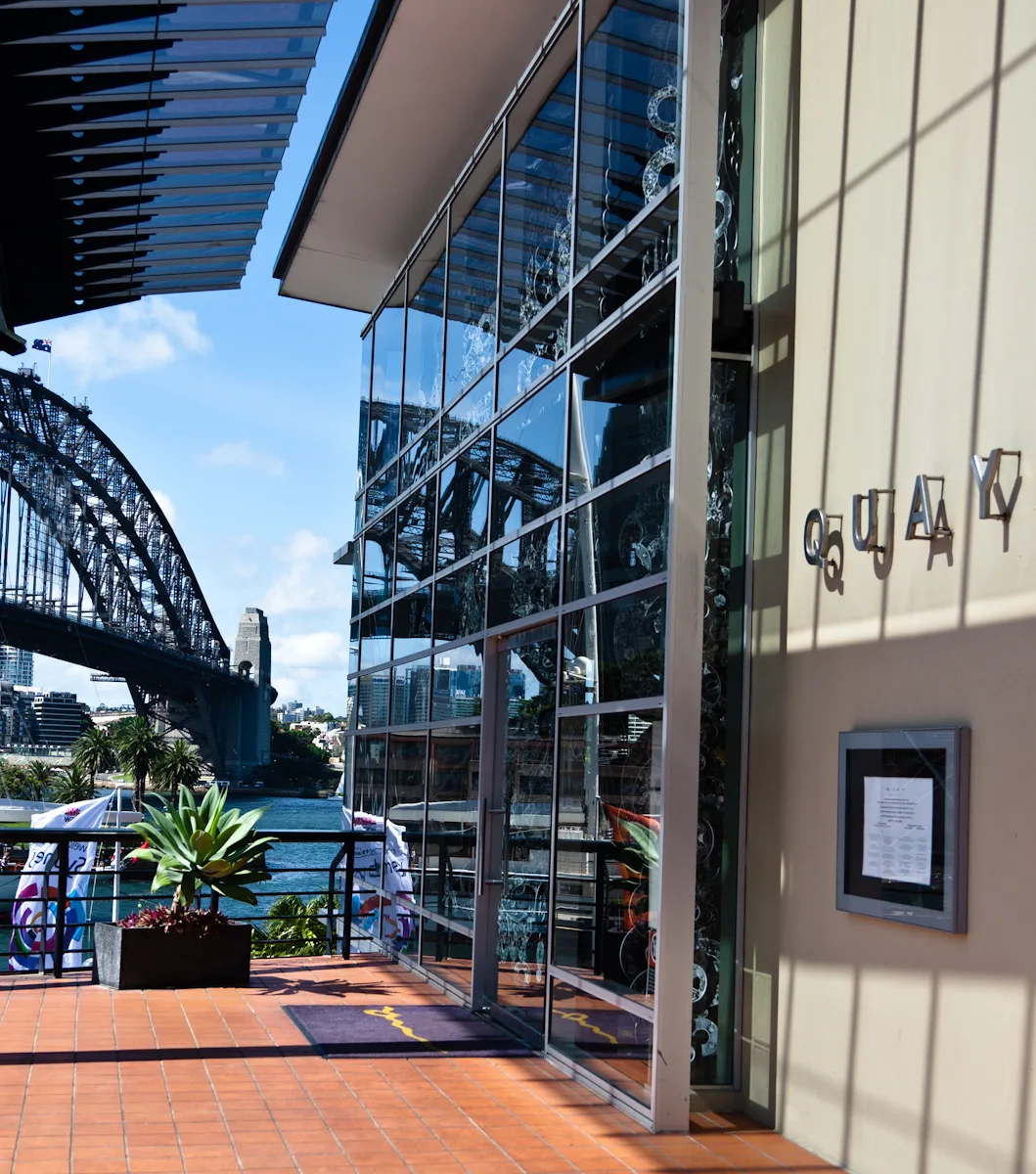 Quay restaurant entrance in Sydney with the Harbour Bridge in the background